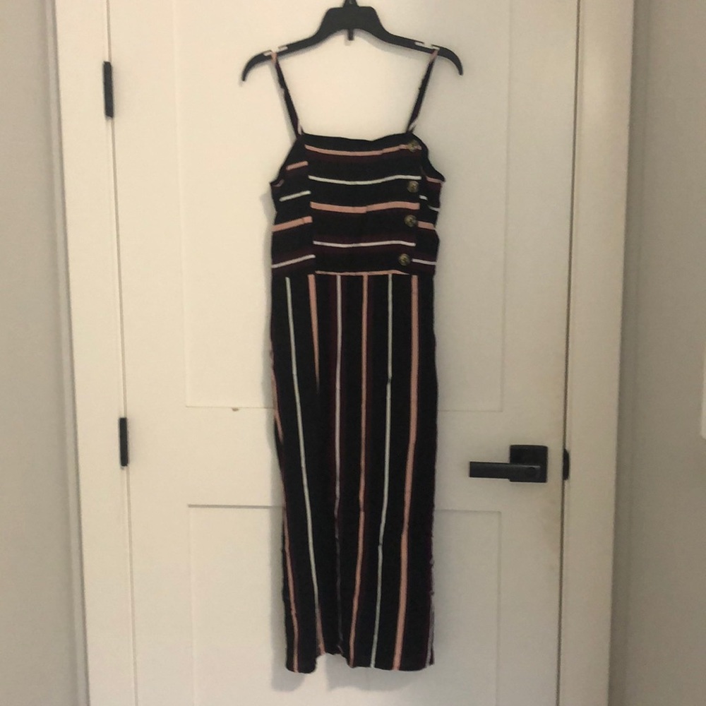 Small black midi dress. Flowy and very comfortable. Never worn.